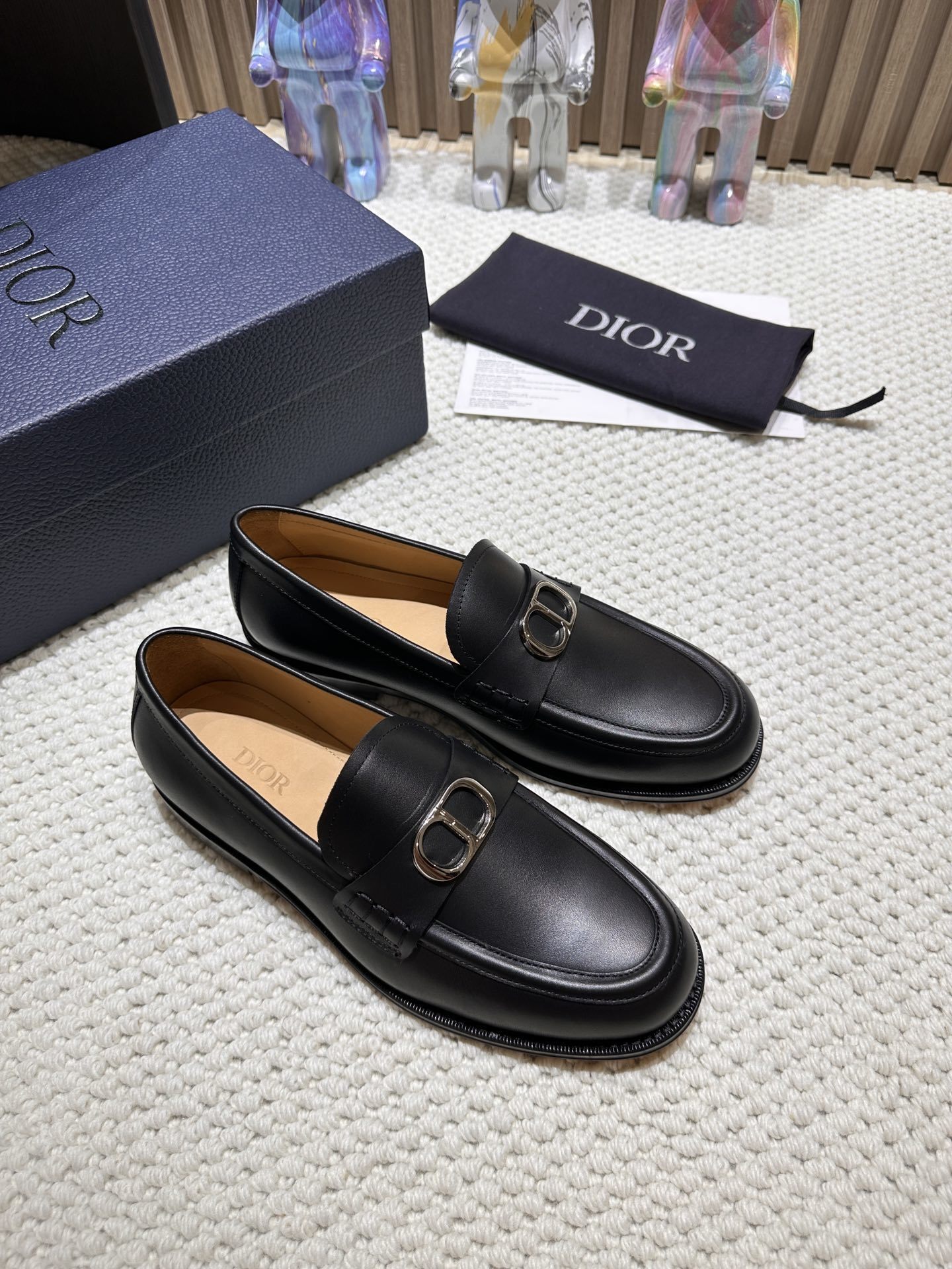 Dior Granville Loafers in black polished calfskin leather with a palladium-finish brass CD Icon buckle.