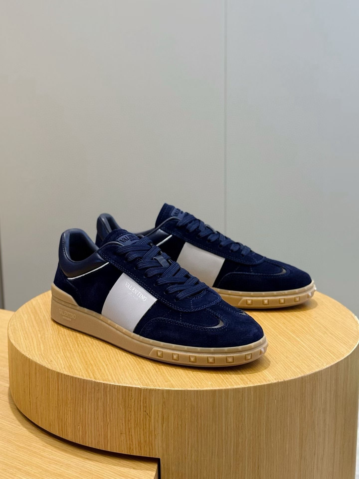 Valentino Garavani Upvillage low-top sneaker in navy suede and white leather