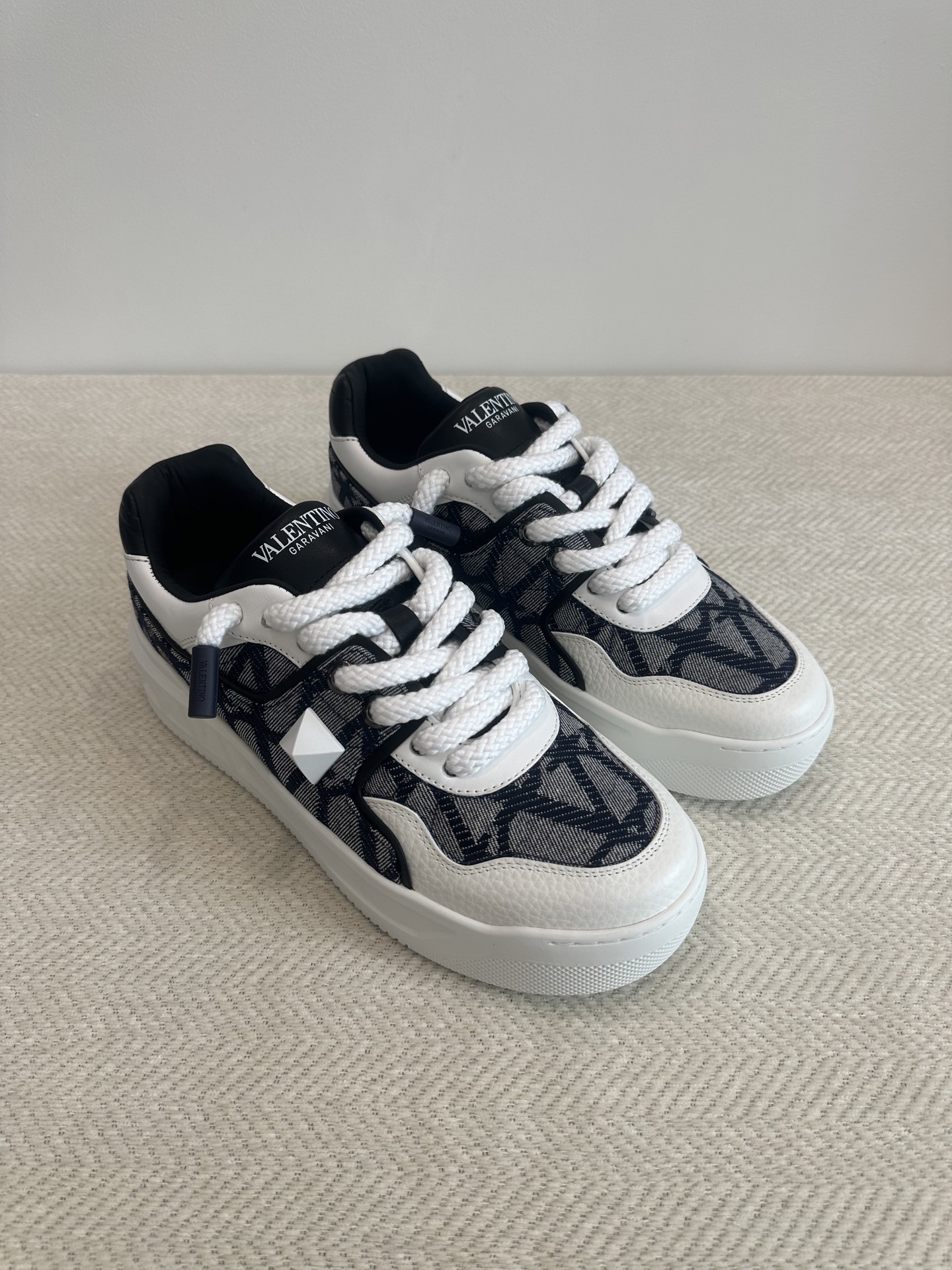 Valentino Garavani One Stud XL low-top sneaker in calfskin and nylon with a Toile Iconographe pattern