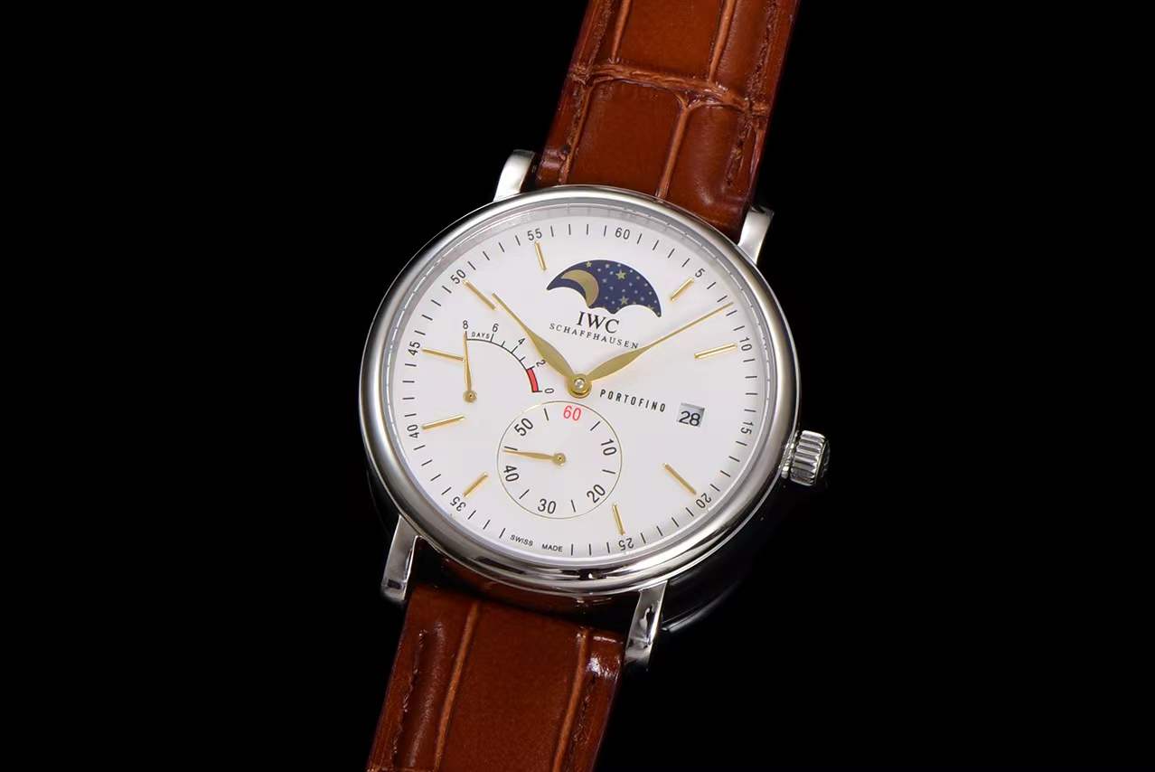 IWC Portofino Hand-Wound Moon Phase watch (Ref. IW516401) with a silver-plated dial, stainless steel case, and a brown leather strap