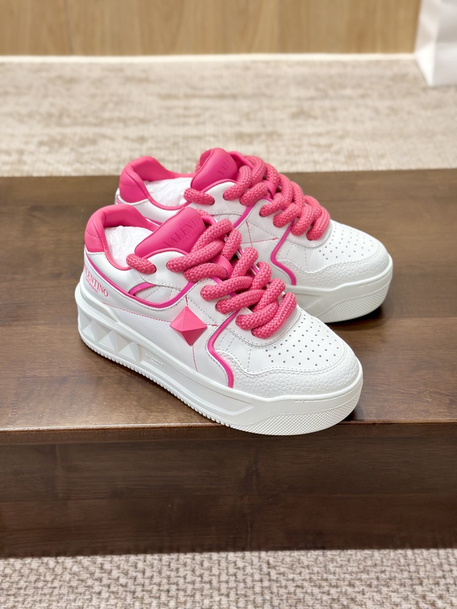 Valentino Garavani One Stud XL low-top sneakers in white nappa leather with contrasting pink laces and details
