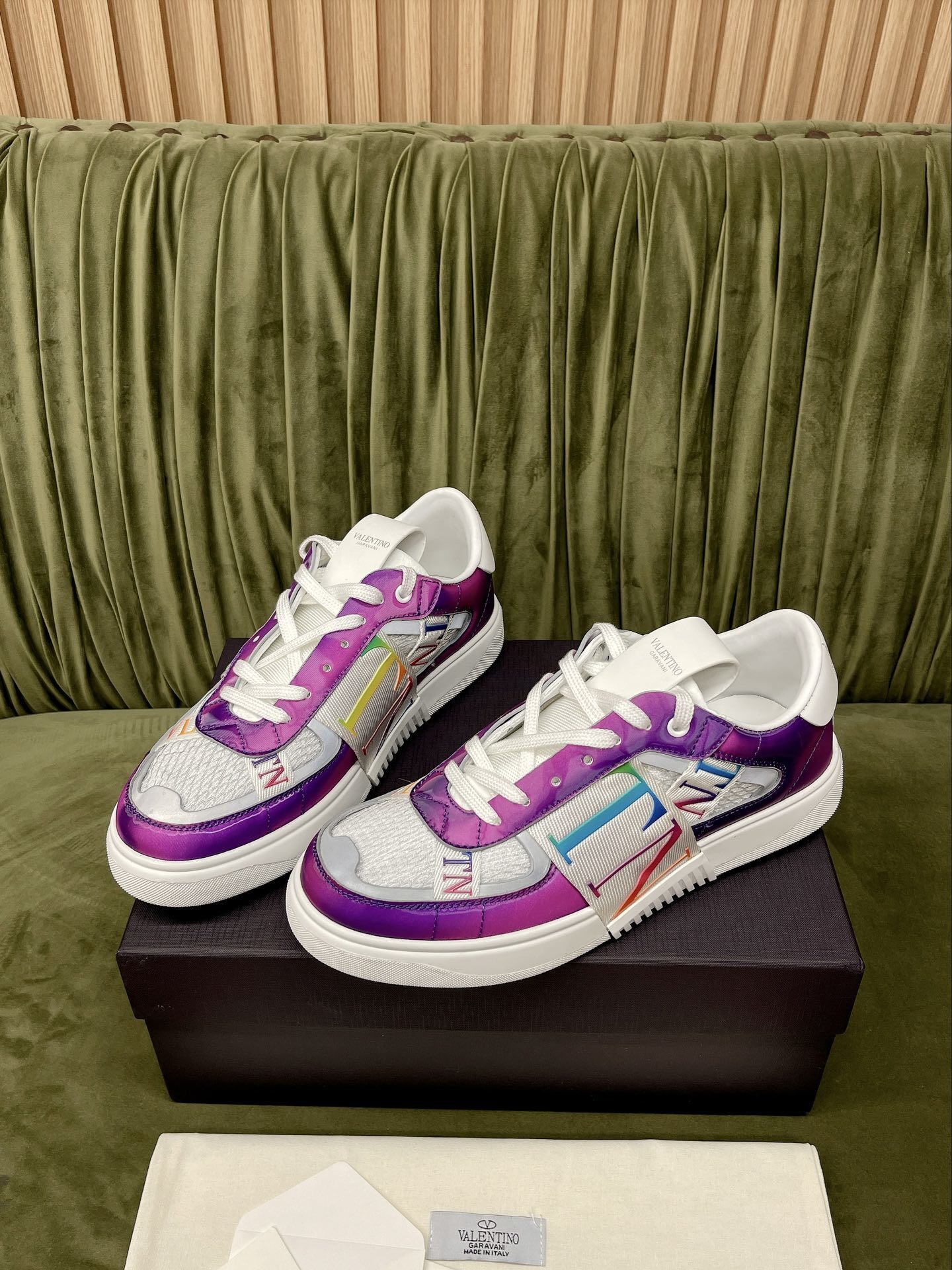 Valentino Garavani VL7N panelled sneakers in a white calfskin leather with a purple and multi-coloured VLTN logo band design