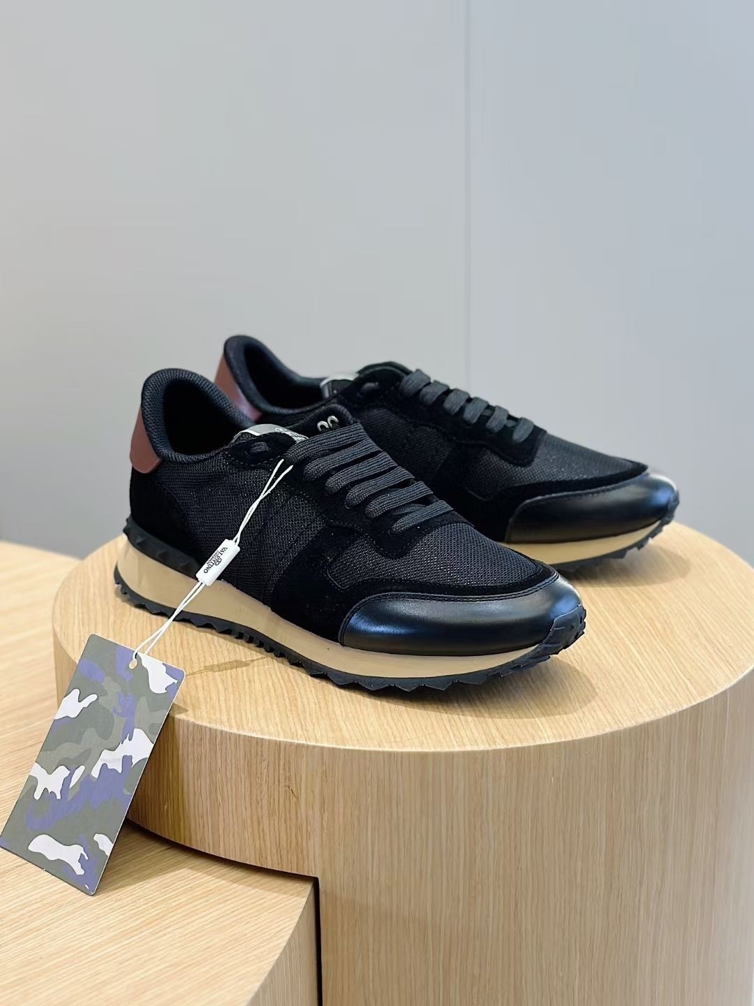 Valentino Garavani Rockrunner low-top sneakers in black fabric and leather with a brown heel