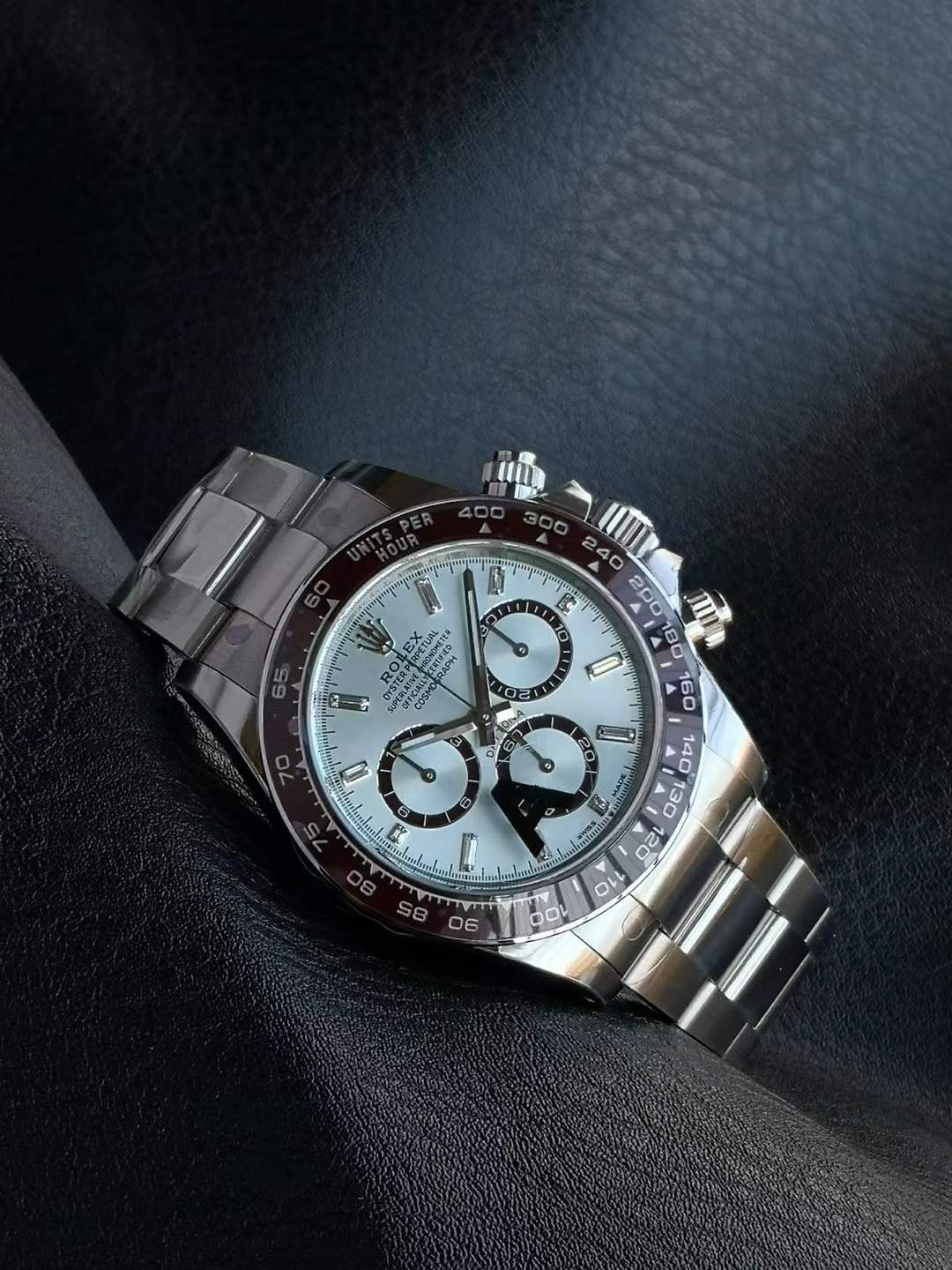 Rolex Cosmograph Daytona in platinum with an ice-blue dial and a chestnut brown Cerachrom bezel insert.