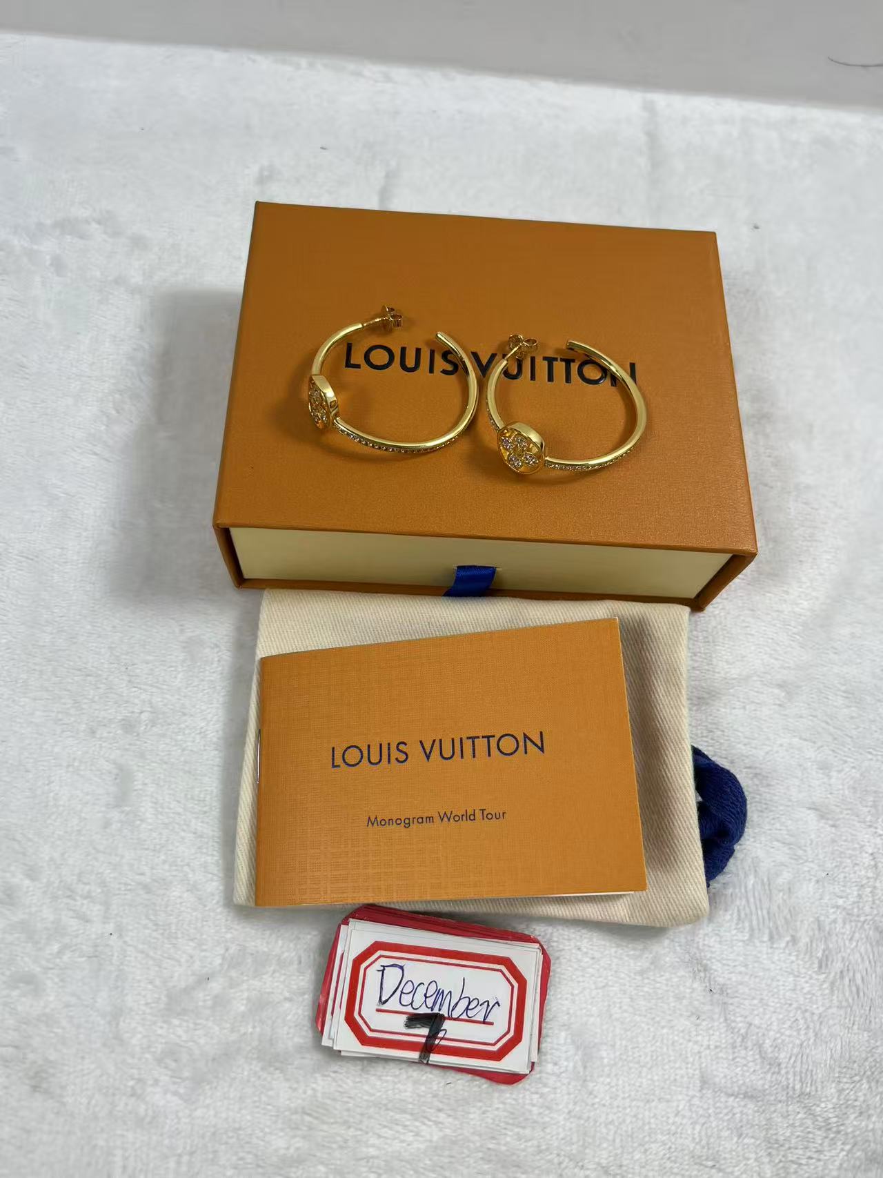 LV hoop earrings with the iconic LV motif