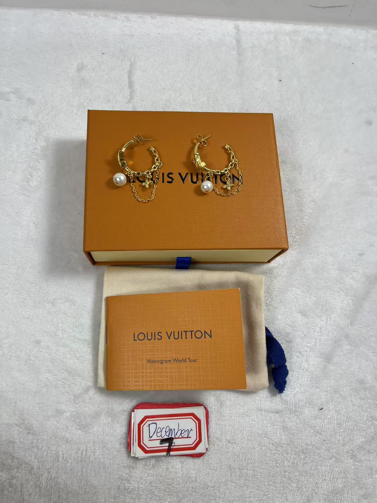 LV gold-tone hoop earrings with pearl and chain details