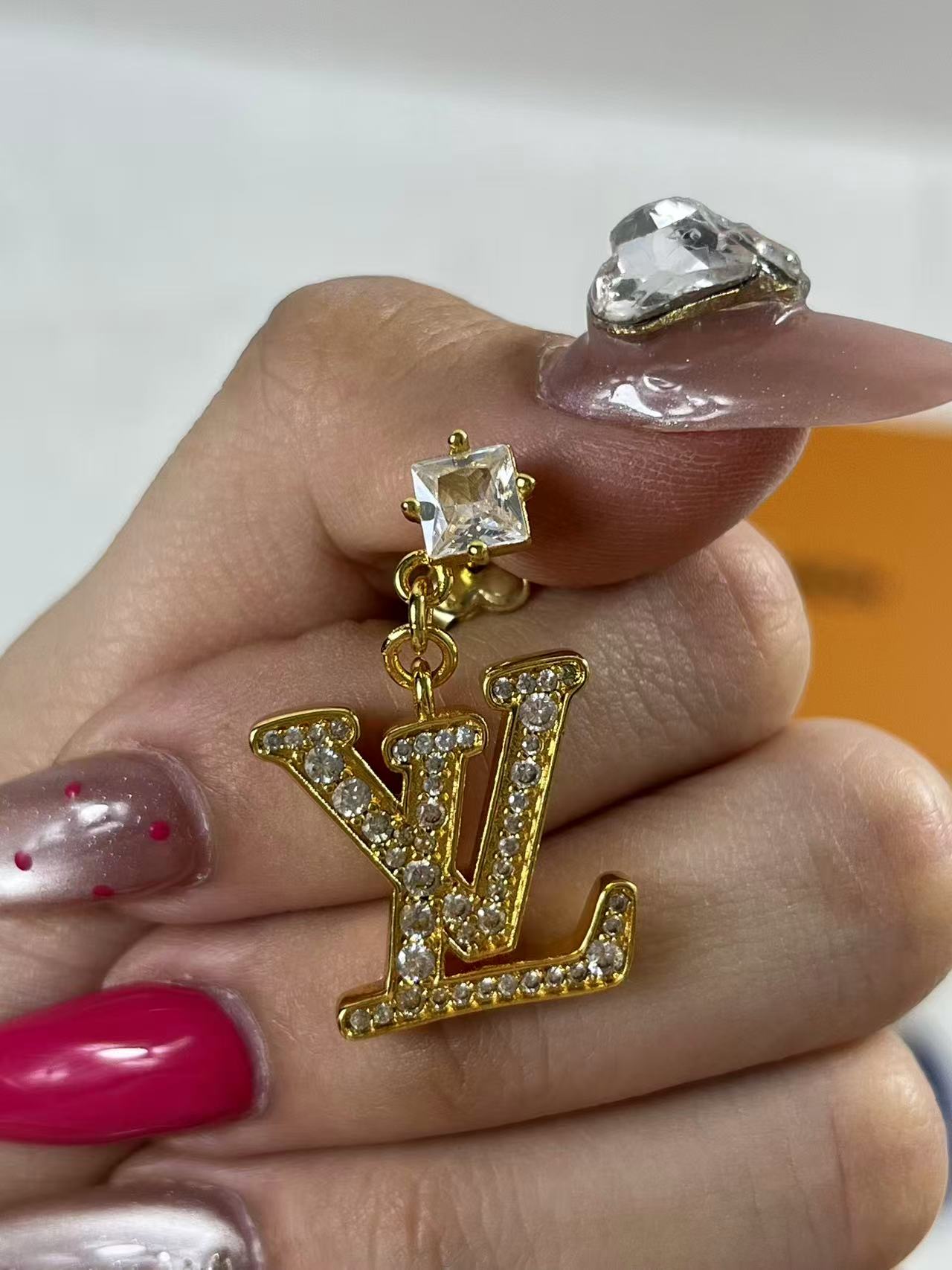 LV Iconic earrings with a gold-color finish and crystal embellishments