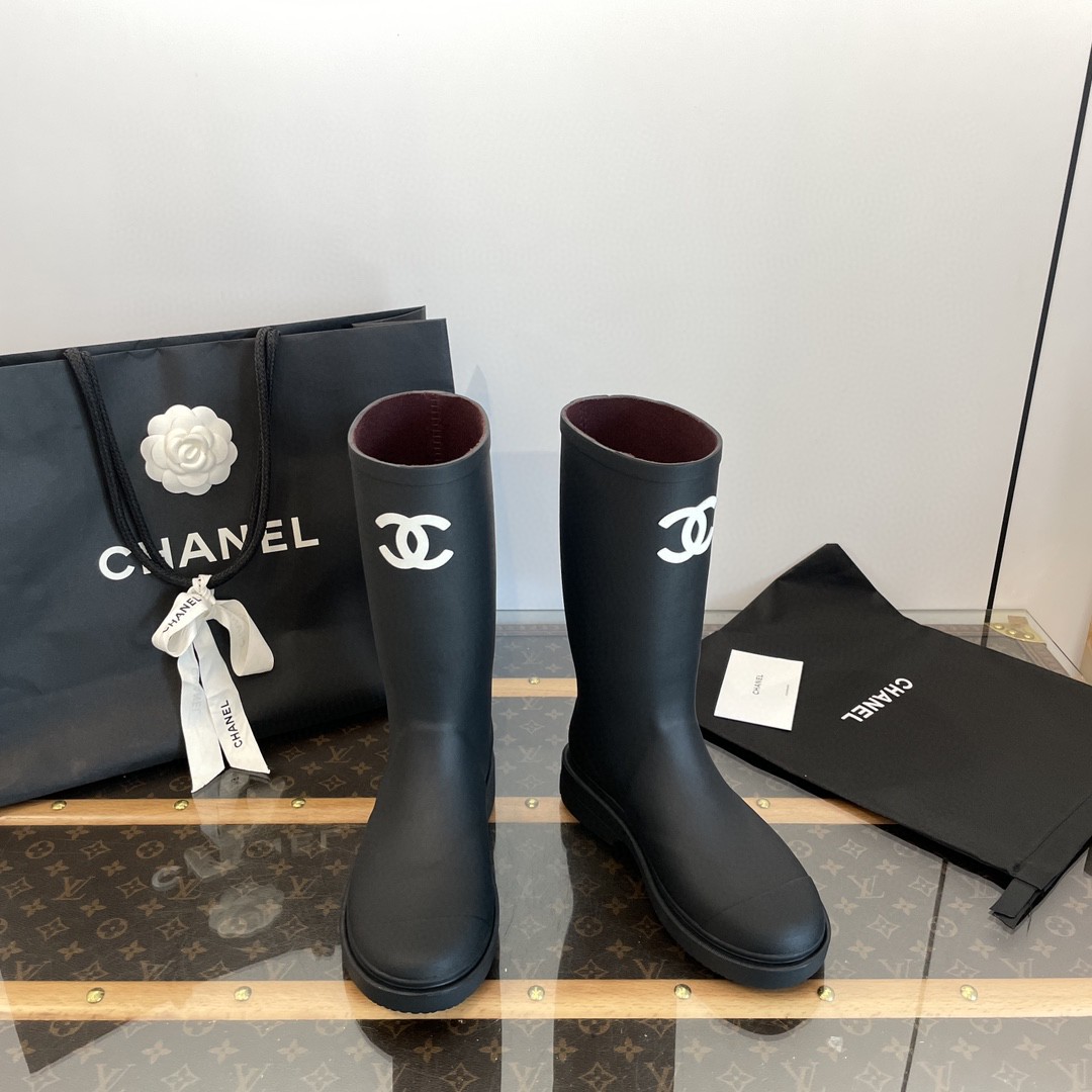 Chanel black rubber rain boots with a white CC logo