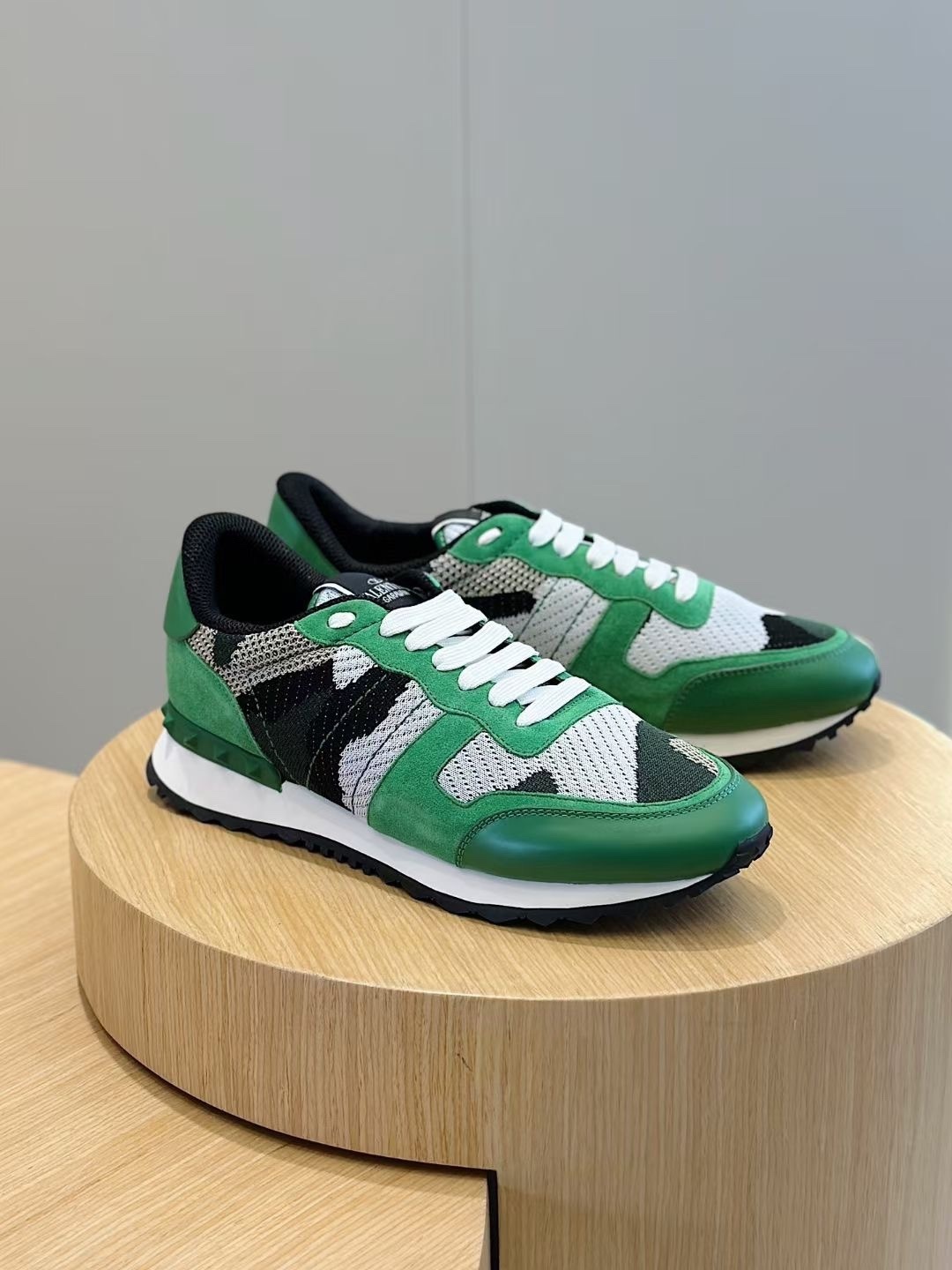 Valentino Garavani Rockrunner sneaker in camouflage print with green leather and suede accents