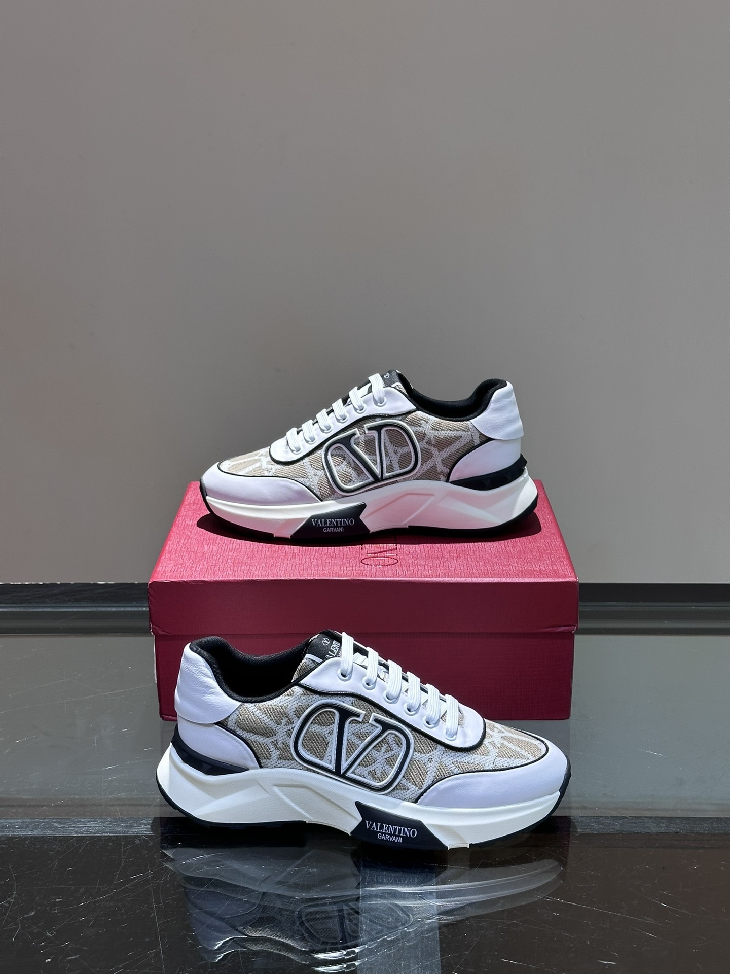 Valentino Net Runner sneaker in white, featuring a knit, rubber, suede, and leather material composition