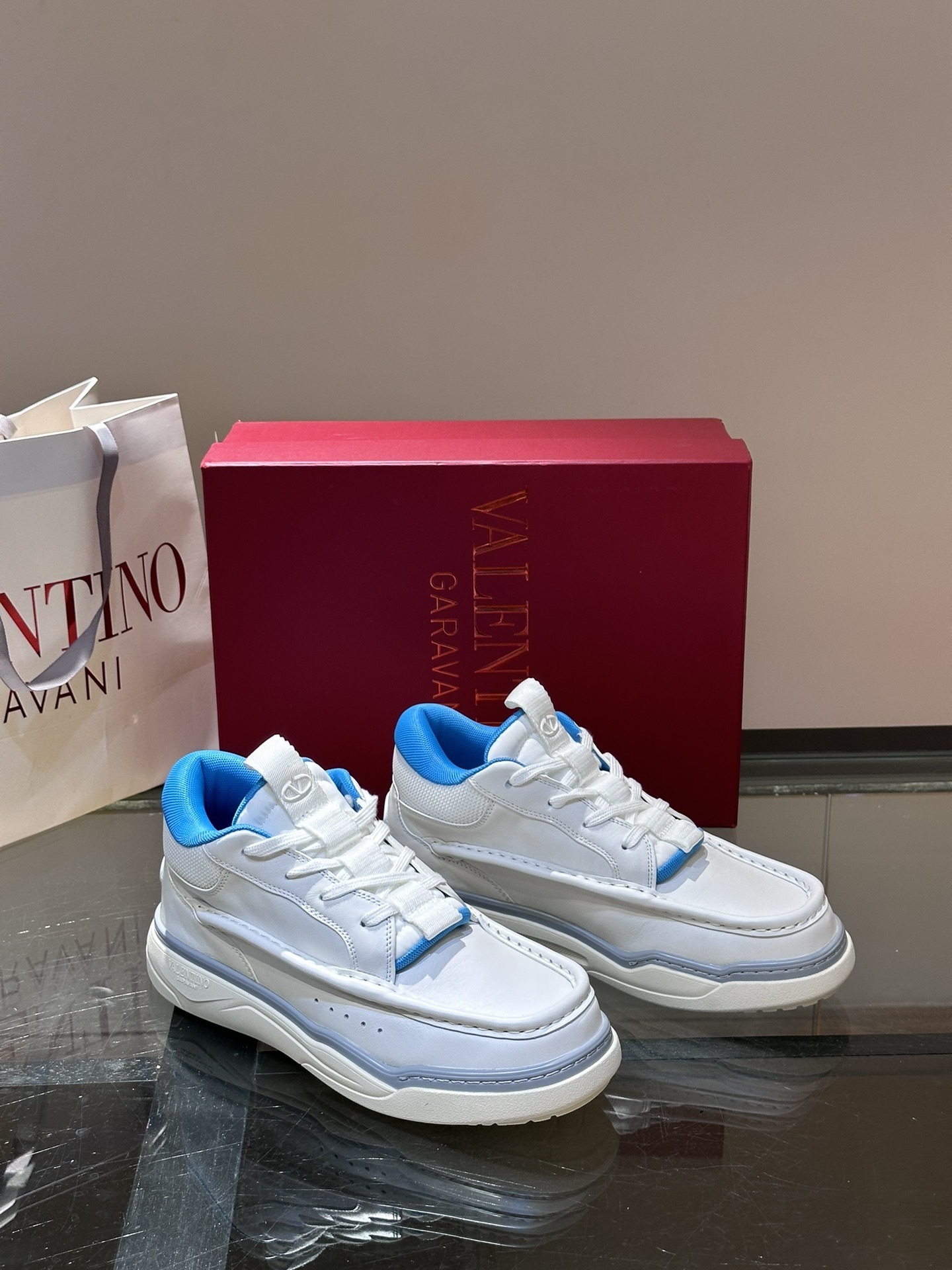 Valentino Garavani Runboot Mid-Top sneaker in white calf leather with fluorescent blue accents