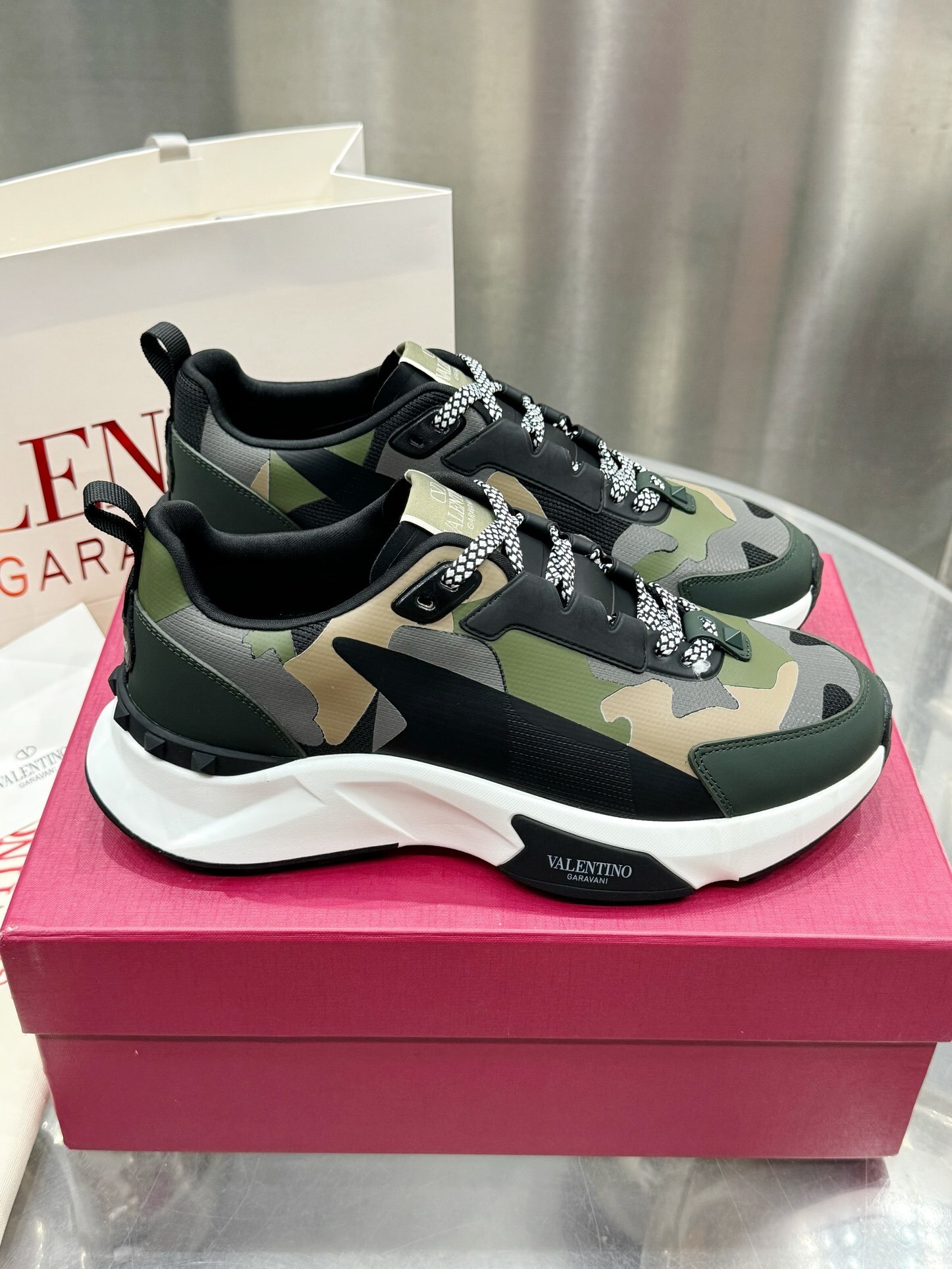 Valentino Garavani True Act low-top trainers in a khaki and multicolor camouflage print