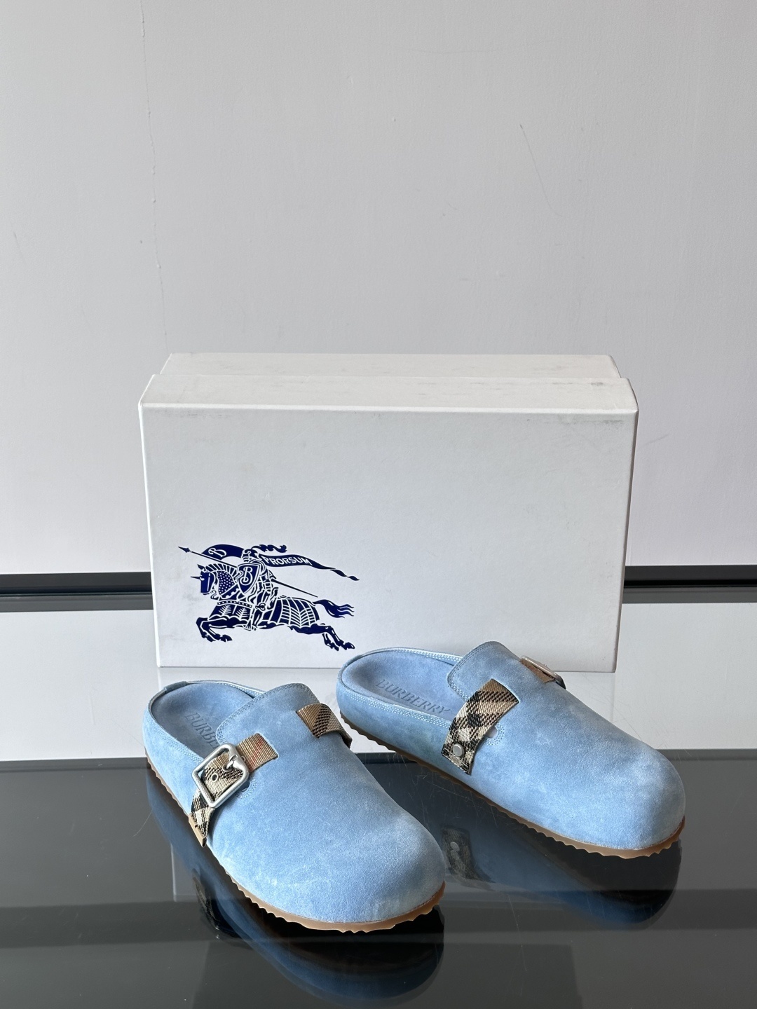 Burberry Urchin clogs in light blue suede