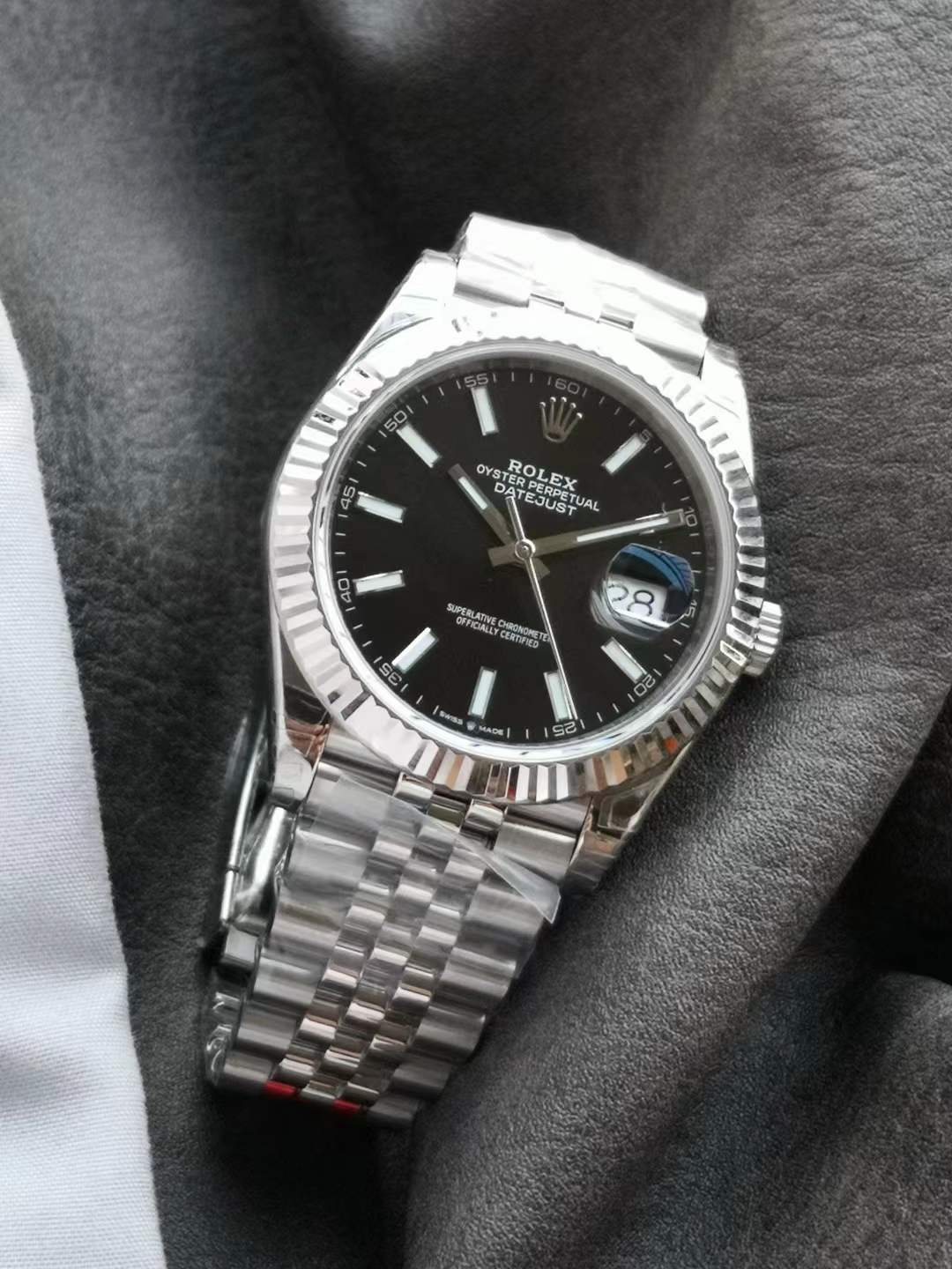 Datejust 41 (Reference 126334) with a black dial, fluted white gold bezel, and a Jubilee bracelet