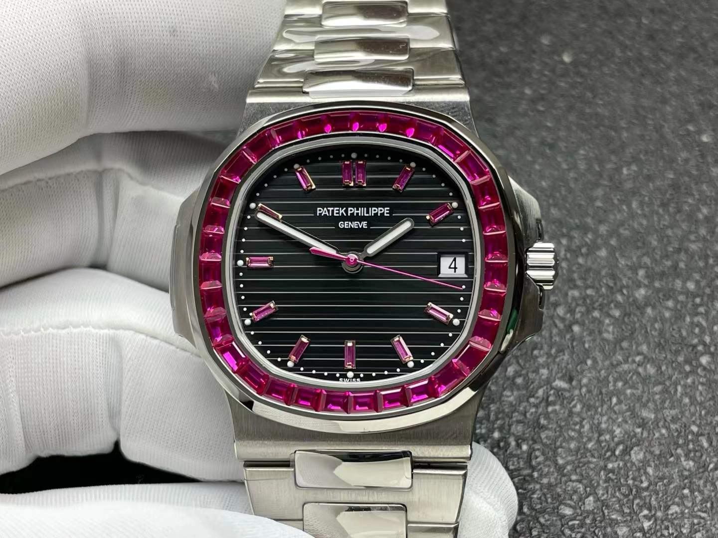 Patek Philippe Nautilus 5711/112P-001 watch in platinum with a ruby-set bezel and a black/grey dial