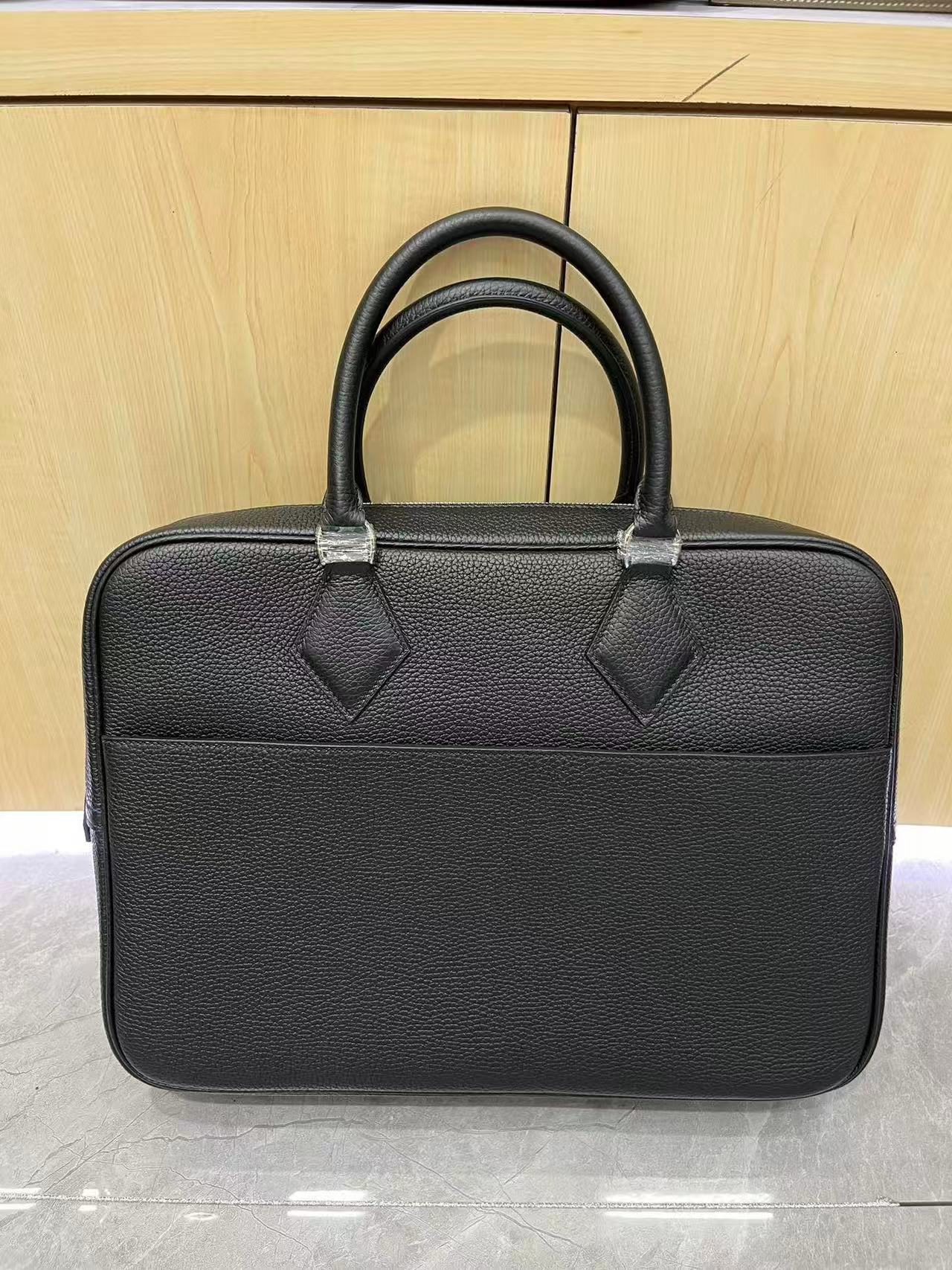 Hermès Plume Dog 38 briefcase in black Fjord leather.