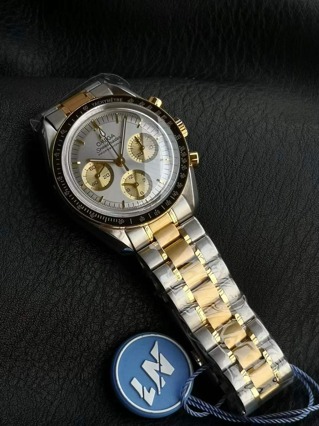 Omega Speedmaster Professional Moonwatch chronograph watch with a two-tone stainless steel and gold bracelet