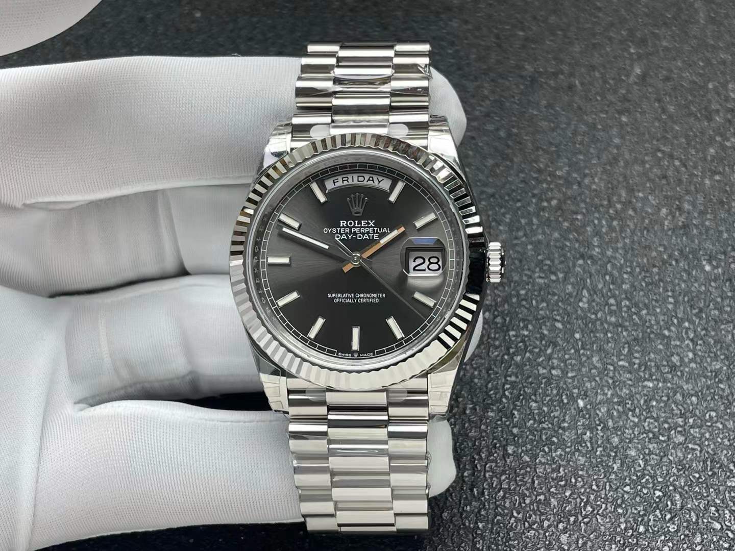 Rolex Oyster Perpetual Day-Date 40 watch in white gold with a fluted bezel, a slate gray dial, and a President bracelet