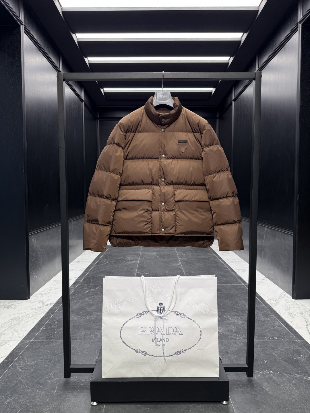Prada Re-Nylon puffer jacket brown color with a classic collar and front button