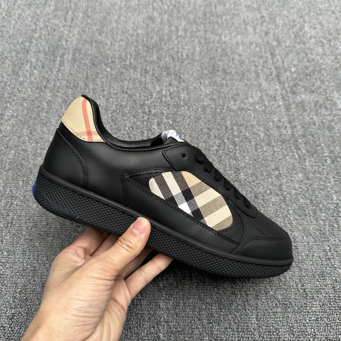 Burberry Check Terrace sneakers in black leather.