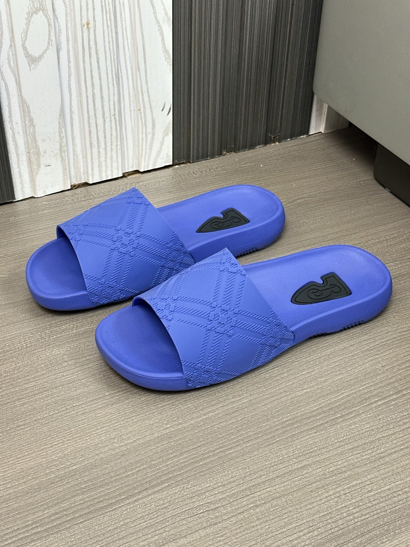 Burberry Check-embossed Dive Slides in cobalt blue rubber