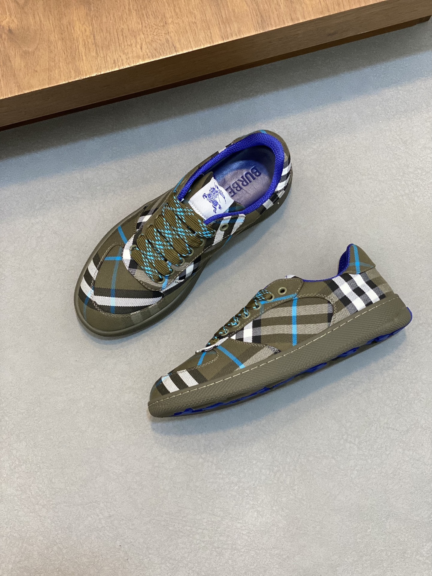 Burberry Check Terrace sneakers in a dark green, navy blue, and light grey
