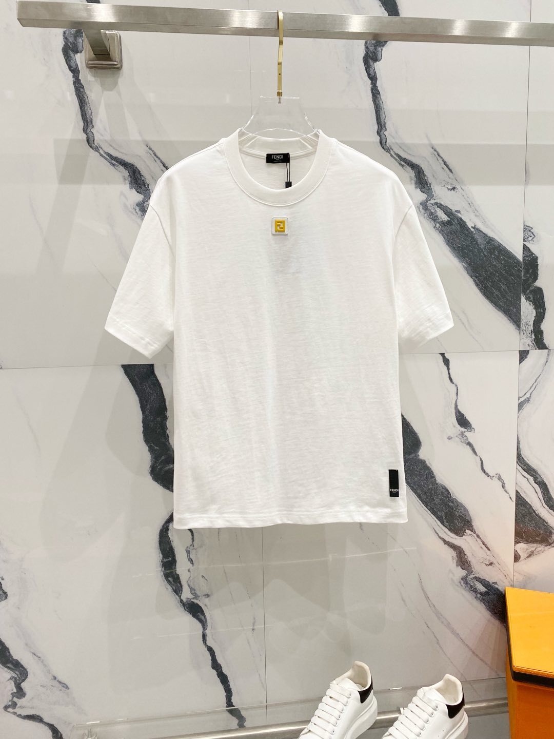 Fendi cotton T-shirt with a small yellow logo plaque detail on the chest.