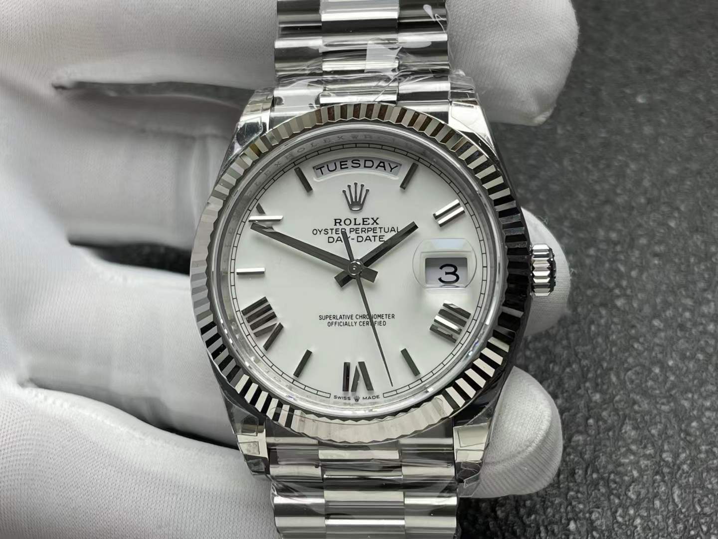 Oyster Perpetual Day-Date watch in 18k white gold with a fluted bezel and a white dial