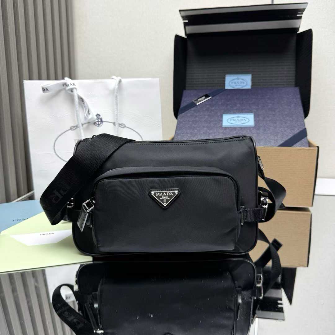 Prada Re-Nylon and Saffiano leather shoulder bag in black.