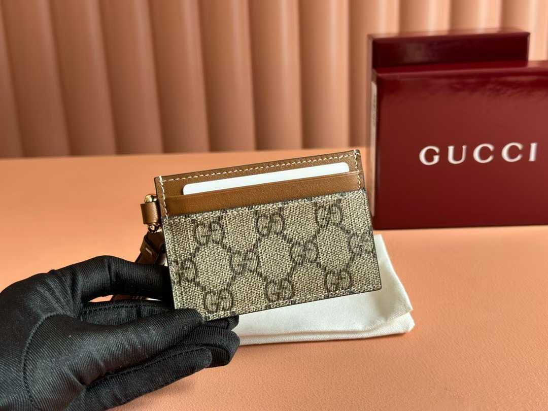 Gucci GG Emblem card case with a strap in beige and brown coated-canvas with tan leather trim