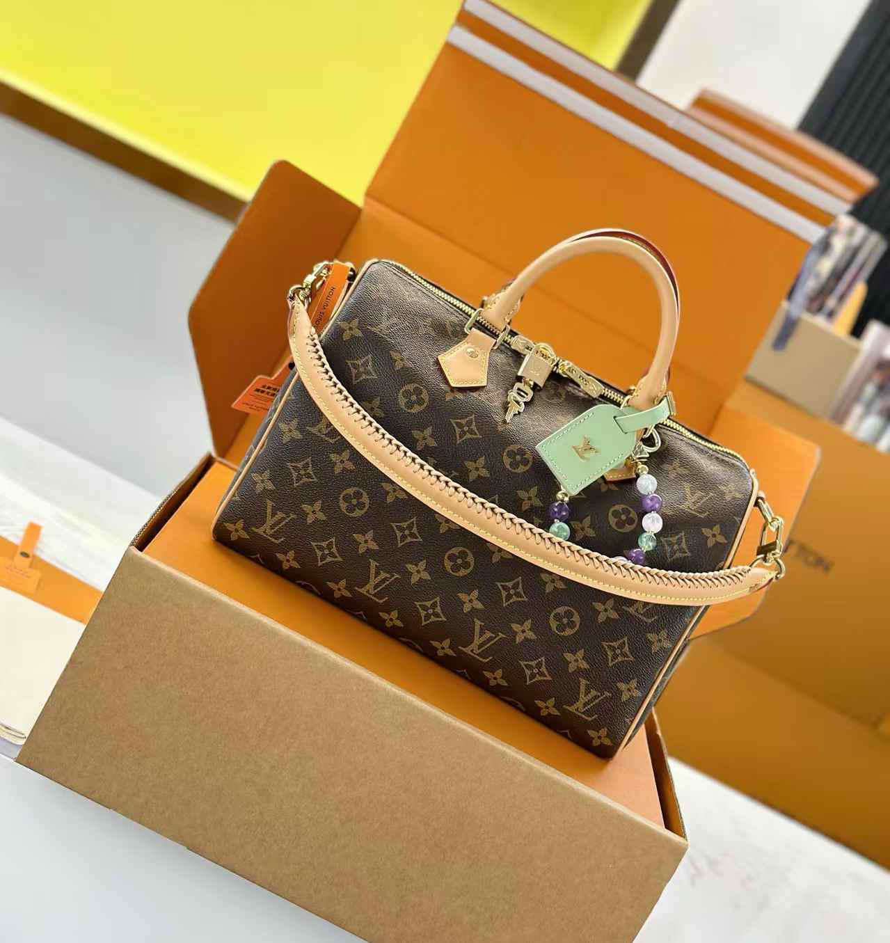 LV Speedy Soft 30 Lucky handbag in monogram canvas with VVN leather trim and a unique talisman charm