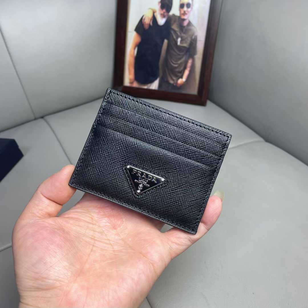 Prada Saffiano leather card holder with the signature enameled triangle logo plaque.