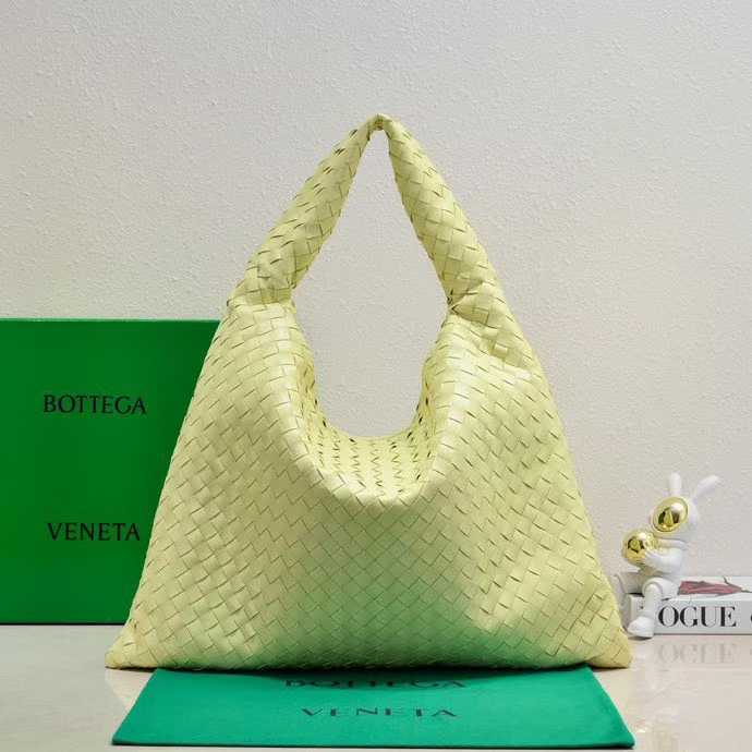 Bottega Veneta Hop shoulder bag crafted from intrecciato leather in an aloe green color