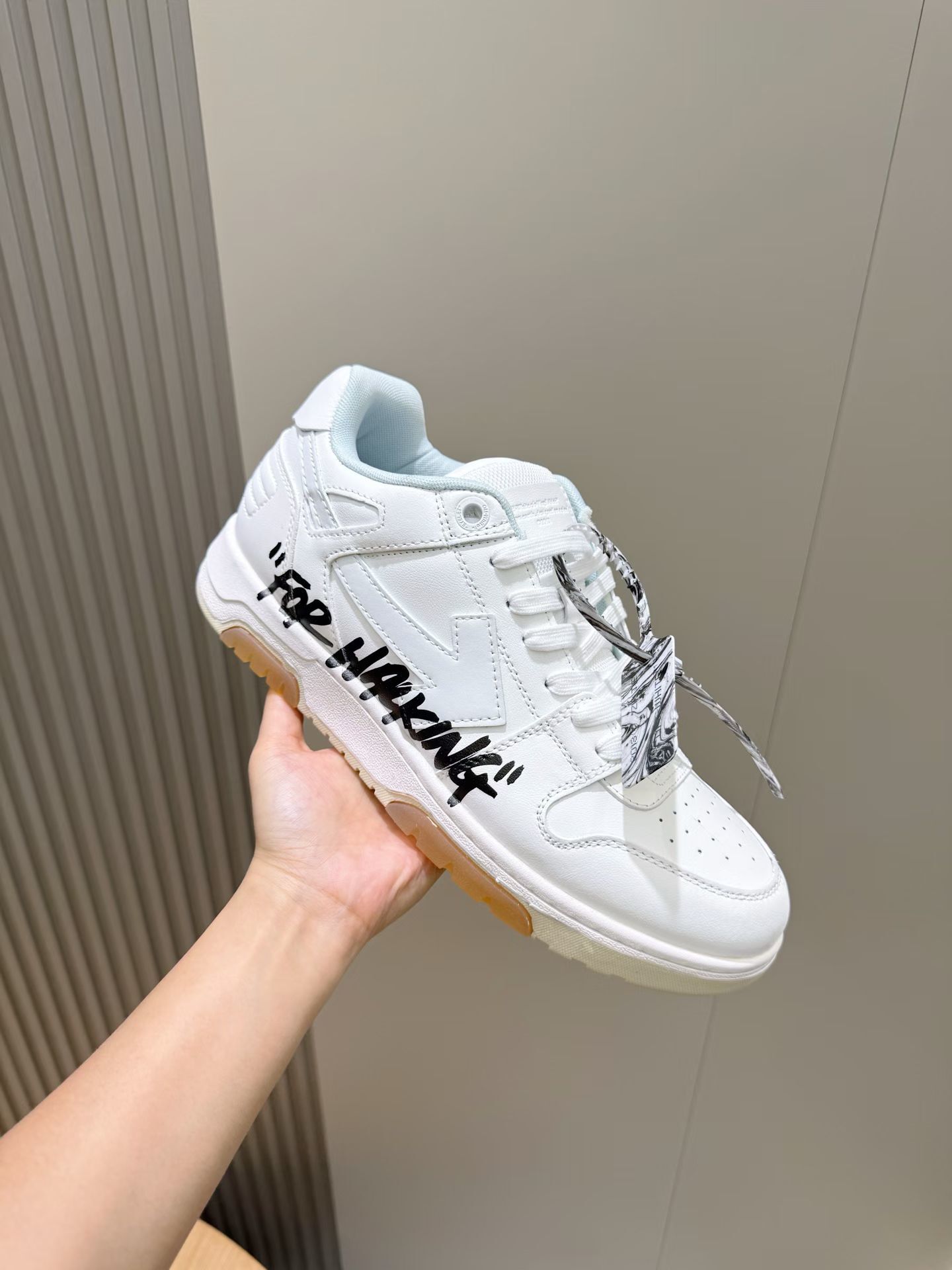 Off-White Out of Office "For Walking" low-top leather sneaker in white with black text