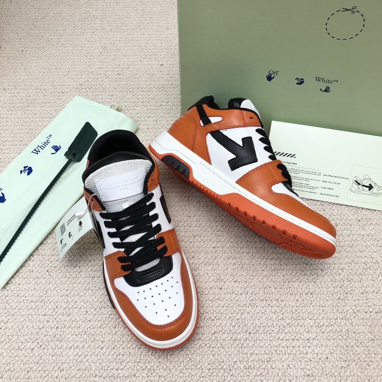 Off-White Out Of Office leather sneakers in an orange and white colorway