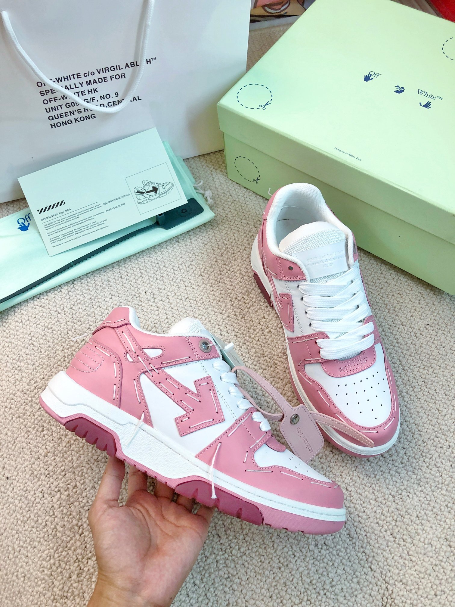 Off-White "Out of Office" (OOO) sneaker in a pink and white