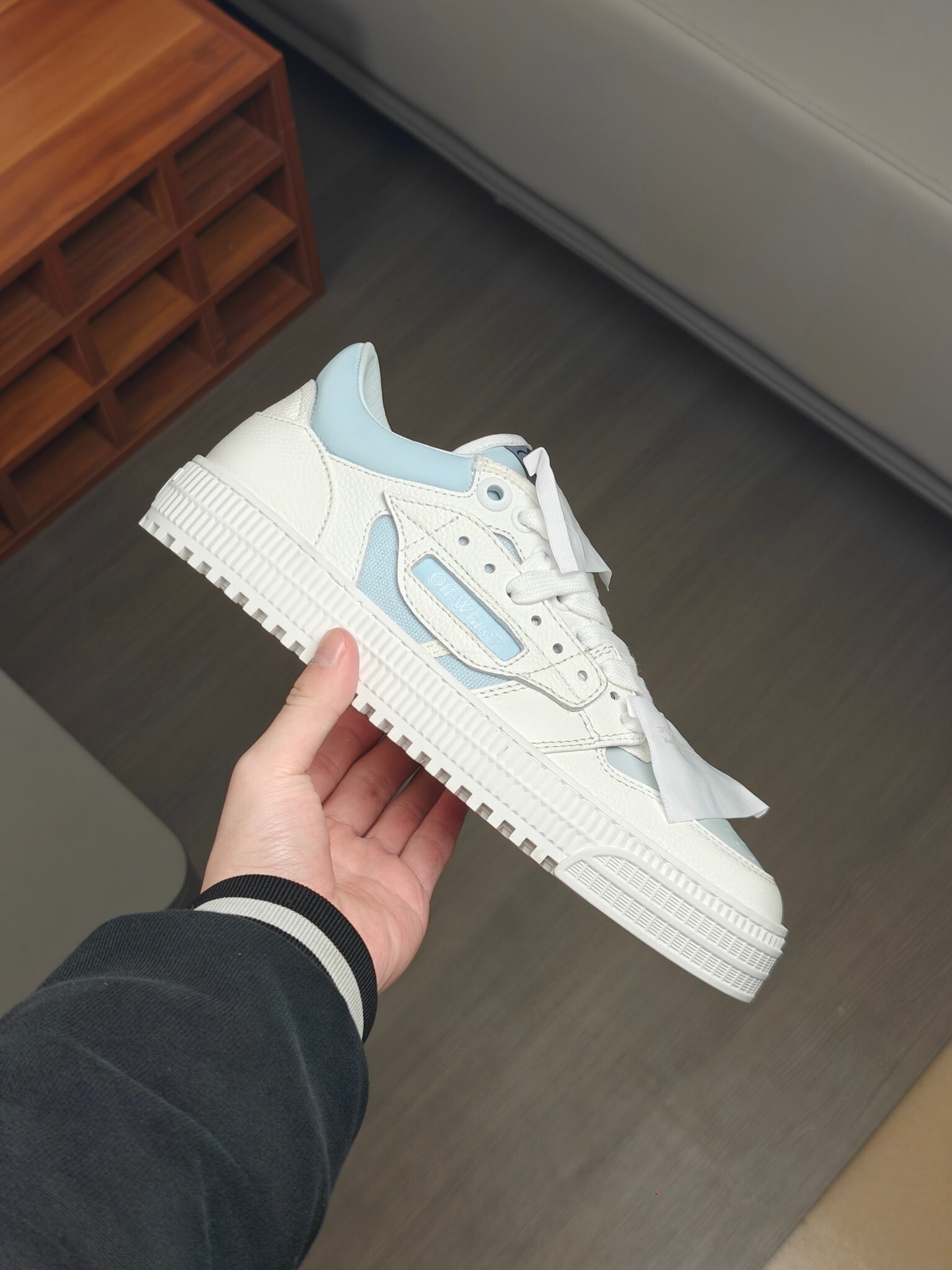 Off-White 3.0 Off Court sneaker in white leather with light blue accents.