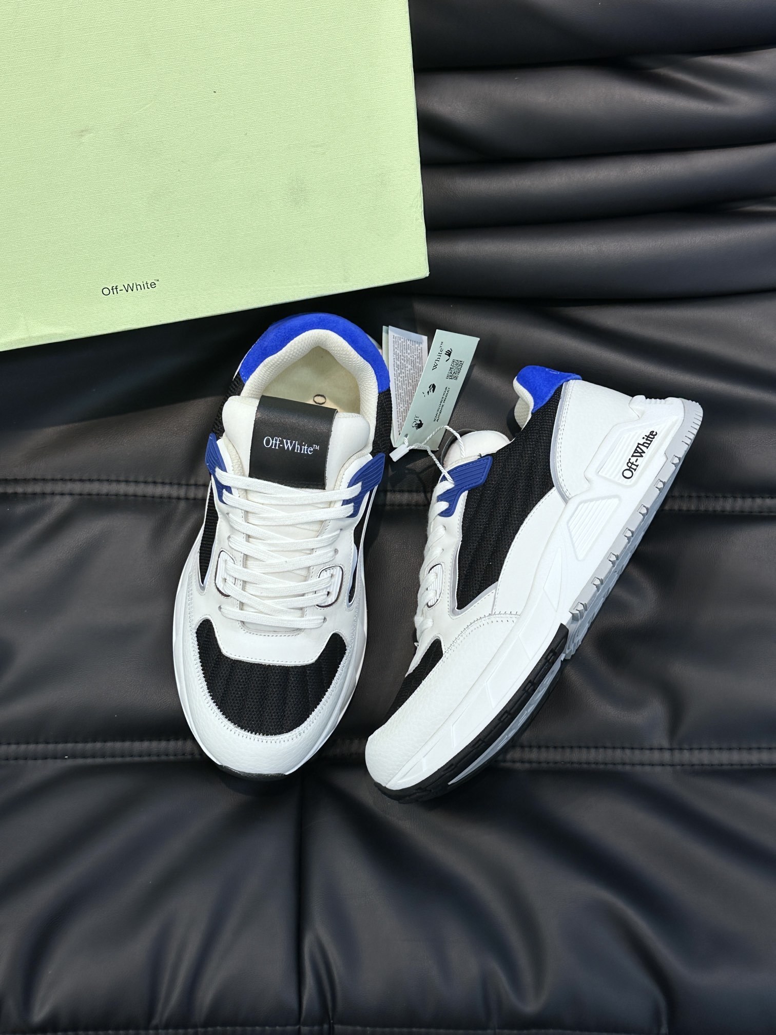 Off-White sneakers in white, black, and blue