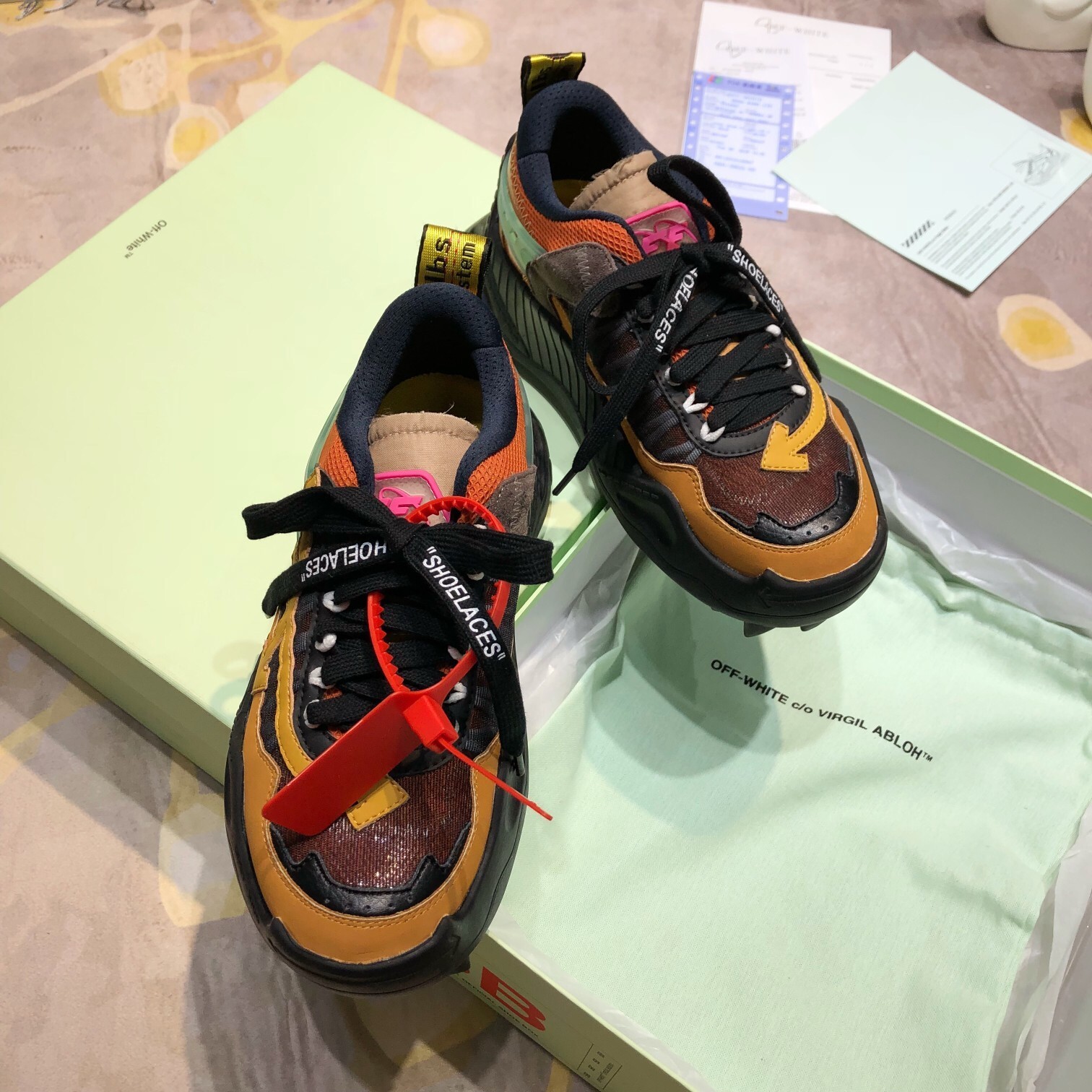 Off-White Odsy-1000 sneakers in a black, beige, red, and orange
