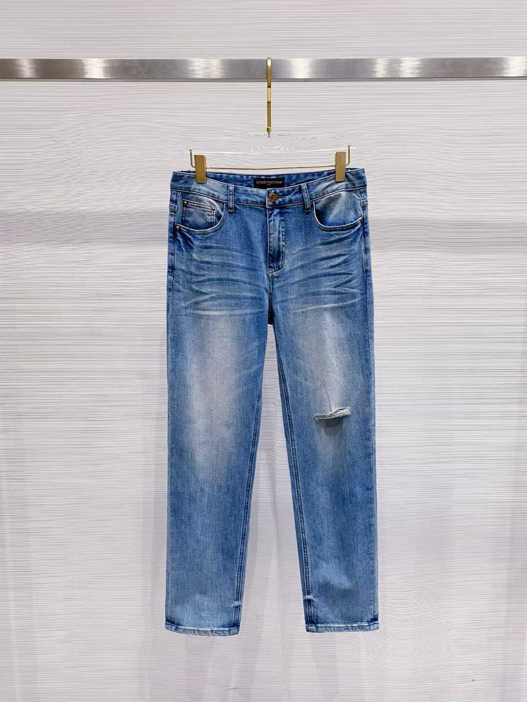 LV light wash distressed denim jeans