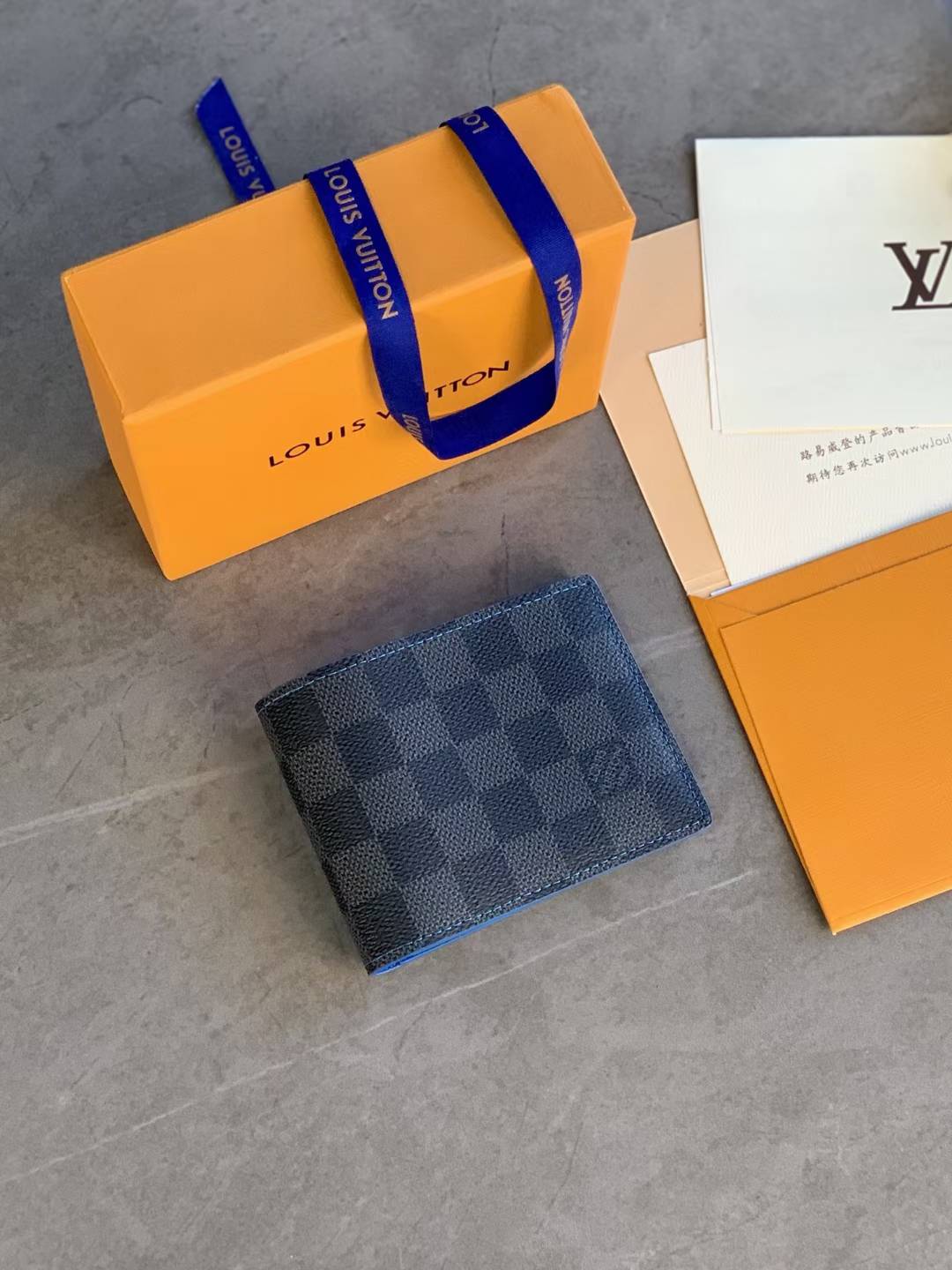 LV men's bifold wallet in the Damier Graphite canvas pattern
