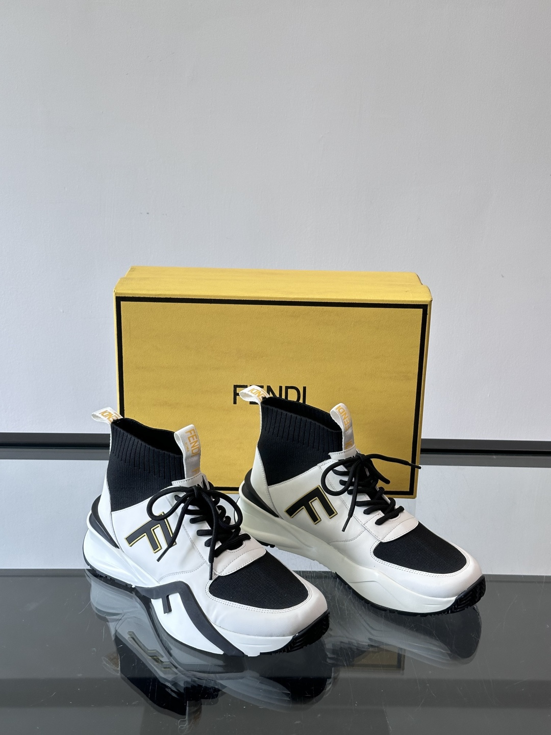 Fendi Flow sneakers in black and white leather with FF jacquard fabric inserts