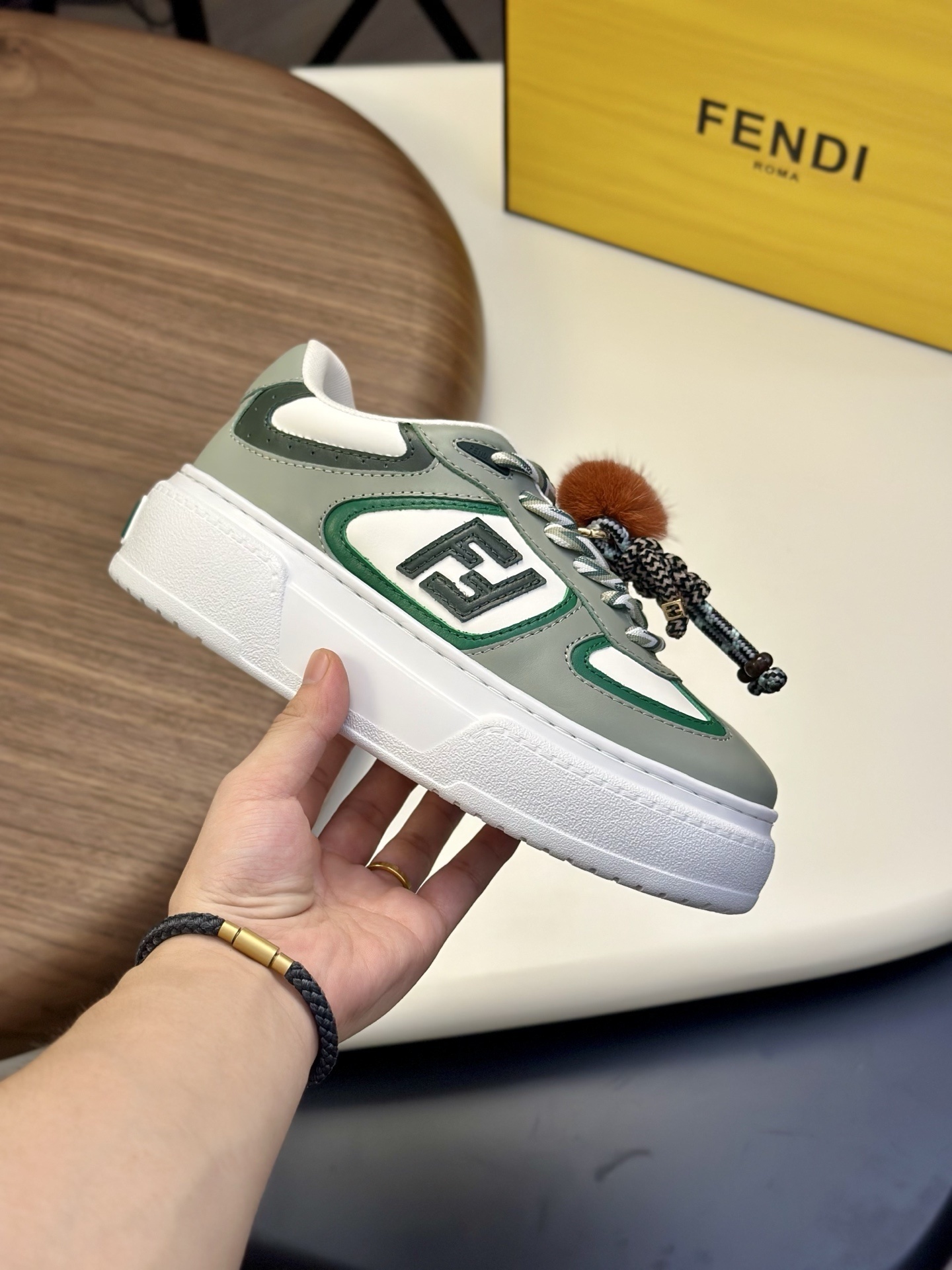 Fendi Match low-top platform sneaker in green leather with a charm