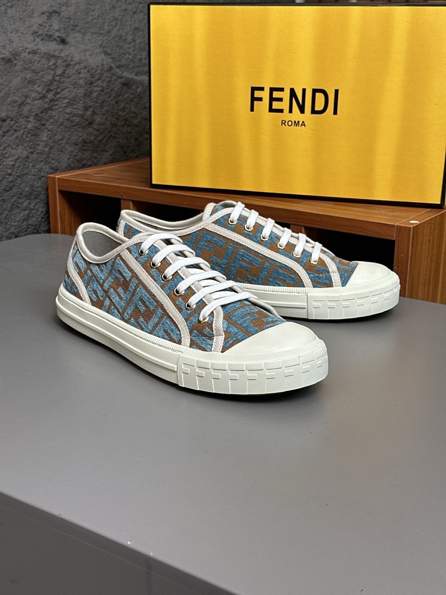 Fendi Domino denim low-top sneakers in light blue with Fendi Roma lettering and a floral motif embroidered in white thread