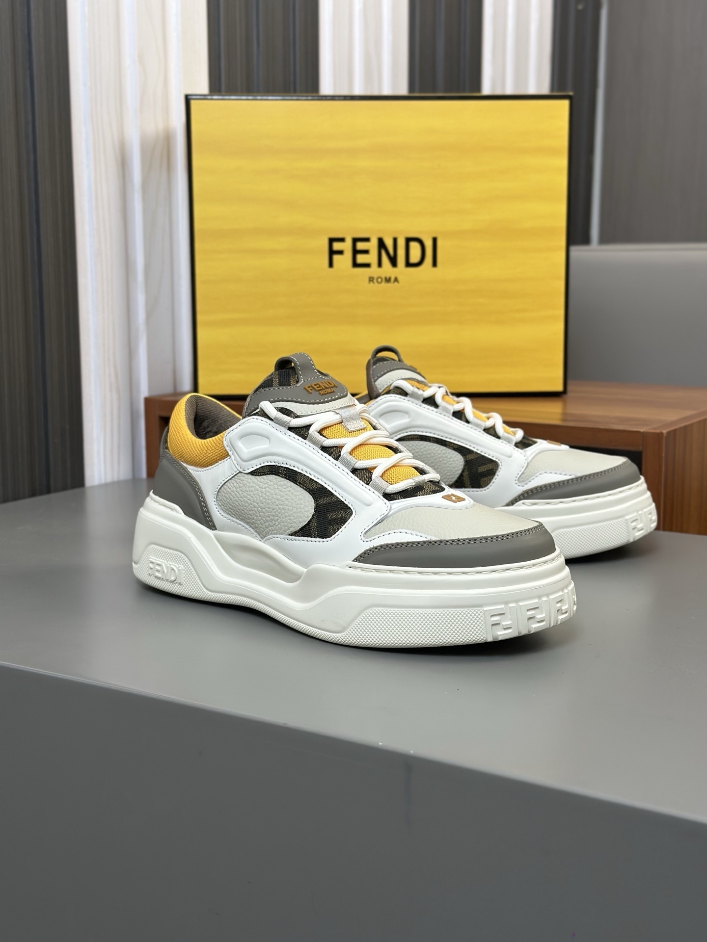 Fendi Force leather low-top sneakers in white, brown, and yellow