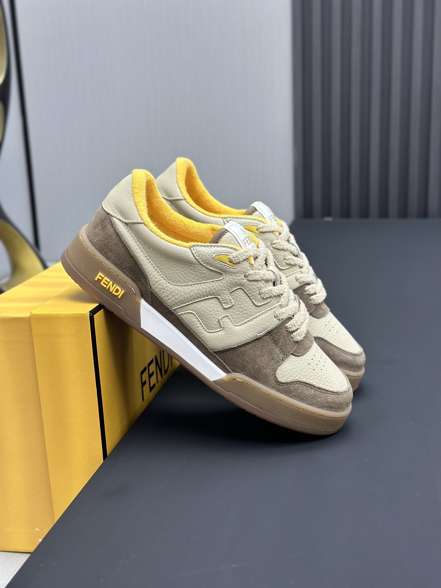 Fendi Match Low Top Sneaker in a beige, brown, and yellow
