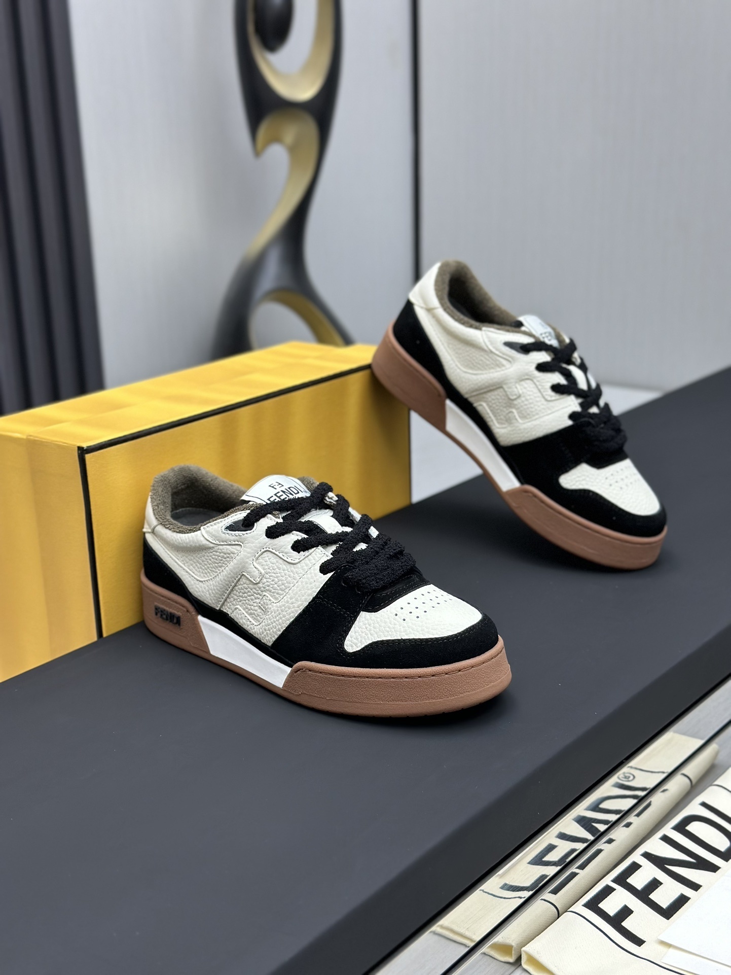 Fendi Match low-top sneakers in black suede with white leather details and a brown rubber sole