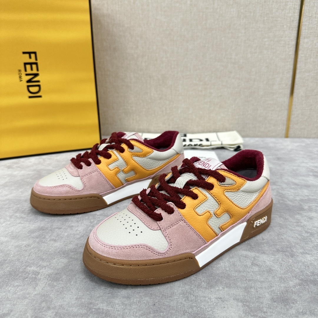 Fendi Match low-top sneakers in a pink, orange, and white colorway with maroon laces