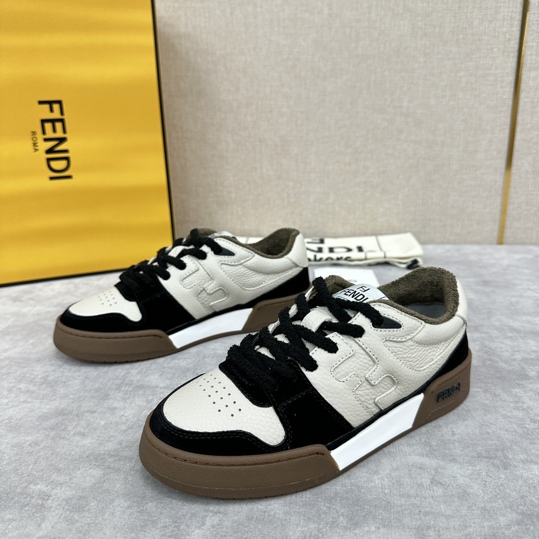 Fendi Match low-top sneakers made of black suede and white leather with a brown rubber sole