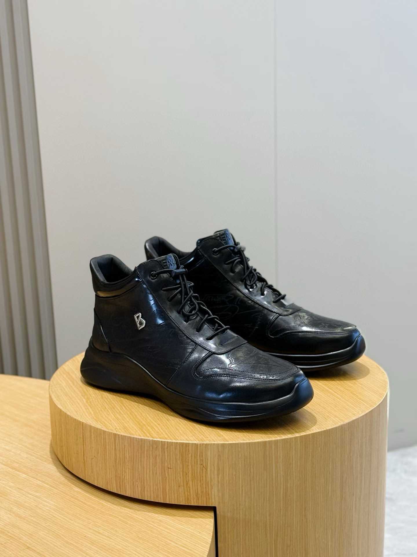 Berluti black leather ankle boots with a B logo